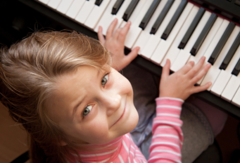 Girl taking piano lessons